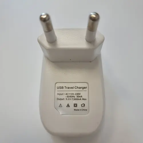 Foto uit de officiële melding: USB Travel Charger USB-oplader — risico: Elektrische schok