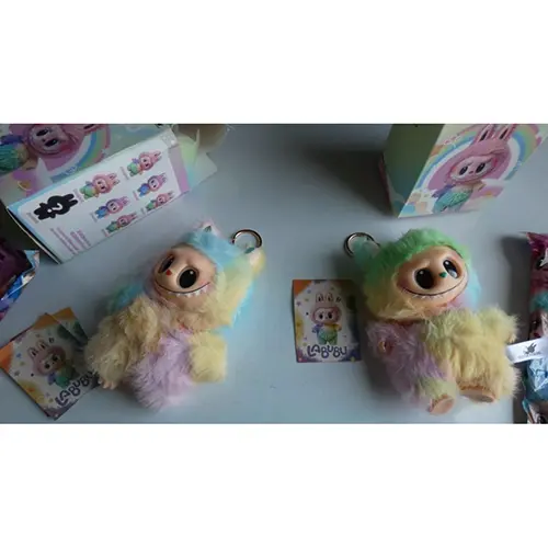 Photo from the official notice: Counterfeit POPMART Peluche Pupazzo Couleur Arc en Ciel. Magnifique douce pour les calins soft toy — choking risk