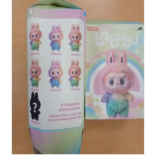Photo from the official notice: Counterfeit POPMART Peluche Pupazzo Couleur Arc en Ciel. Magnifique douce pour les calins soft toy — choking risk