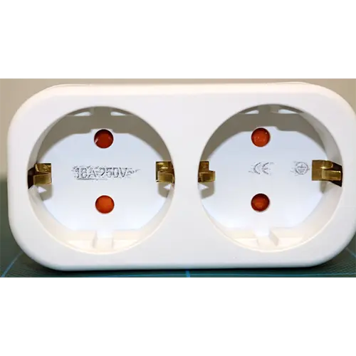 Photo from the official notice: Doppelstecker für Steckdose, ... für Küche Büro double socket adaptor — electric shock risk