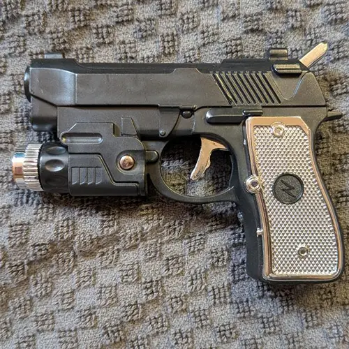 Foto do aviso oficial: Pistol Lighter Isqueiro de novidade — risco: Queimaduras & Choque elétrico