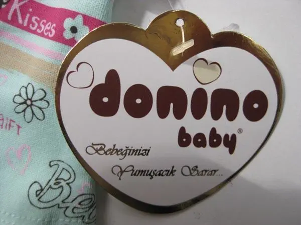 Photo de l’avis officiel: Donino Tenue de bébés — risque: Étouffement