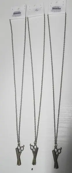 Foto do aviso oficial: Náhrdelník nužky bronz ("Necklace scissors bronze") Colar com pingente — risco: Químico