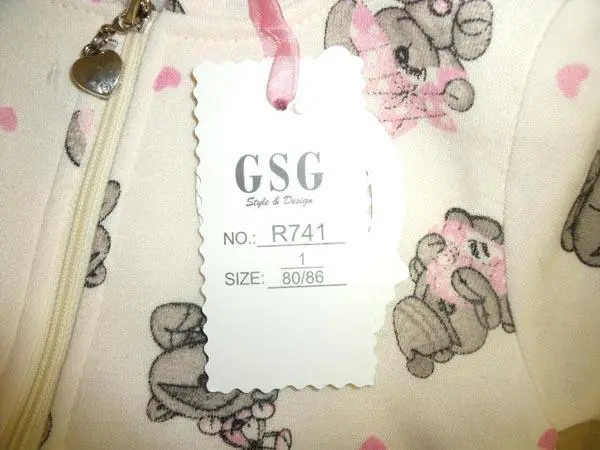 Photo from the official notice: GSG babies' clothing set — choking risk