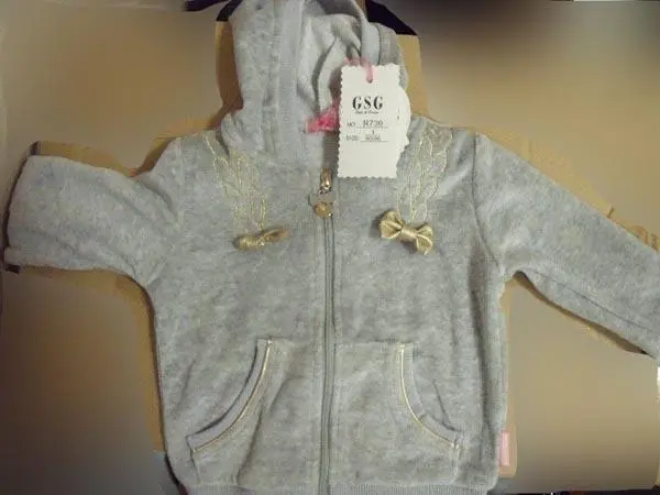 Photo from the official notice: GSG babies' clothes — choking risk