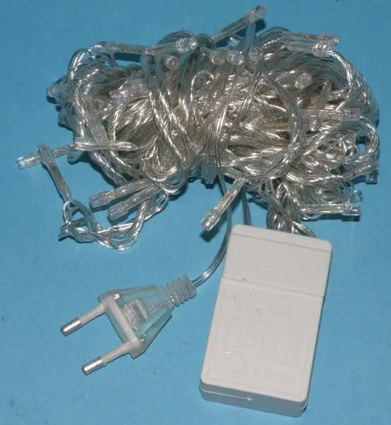 Photo from the official notice: 100L LED (on the packaging) / KARACSONYI EGO (on a label) lighting chain — electric shock & fire risk