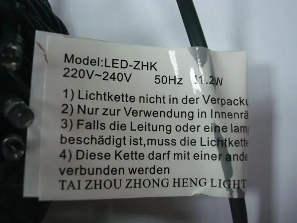 Photo from the official notice: Light up your life this Christmas - 100L LED Lights / 140 Lampadas lighting chain — electric shock risk