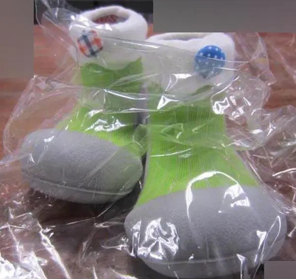 Photo from the official notice: ATTIPAS babies' bootees — choking risk