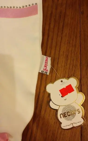 Photo from the official notice: Necix's babies' clothing set — choking risk (A12/0431/16)
