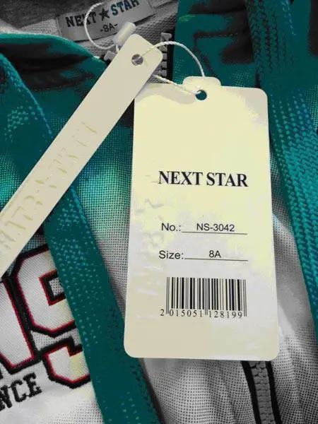 Foto uit de officiële melding: NEXT STAR Kinderkleding set — risico: Verwonding & Verwurging