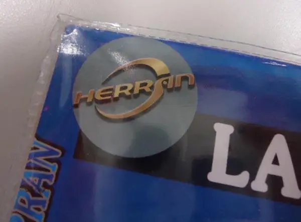 Photo from the official notice: Herran Lámpara de Trabajo work light — burns & fire risk