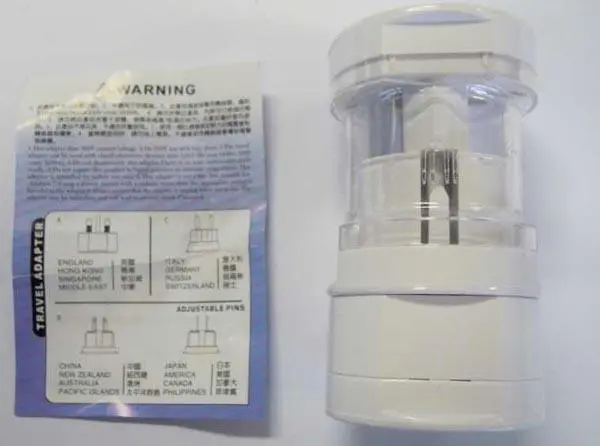 Photo from the official notice: Newtop Adaptor travel plug adaptor — electric shock risk