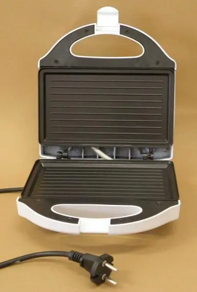 Foto uit de officiële melding: NIKAI JAPAIV Sandwich Maker / As Szendvicssütő Broodjesmaker — risico: Elektrische schok