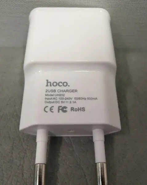 Photo from the official notice: Hoco TRAVEL CHARGER power supply unit — electric shock & fire risk