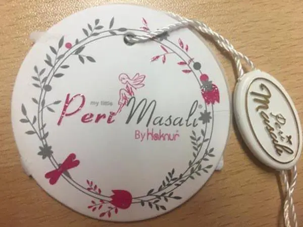 Foto aus der offiziellen Meldung: PERI MASALI Kinder T-Shirt — Risiko: Ersticken