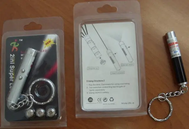Foto uit de officiële melding: Laserpointers  1) 2 in 1 Super Geleide Lamp en Ke — risico: Aantasting van het gezichtsvermogen