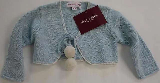 Photo from the official notice: Neck &amp; Neck babies’ knitted jacket — strangulation risk