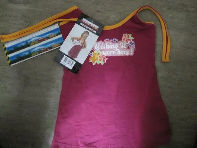 Foto do aviso oficial: NEW BASIC Vestido da menina — risco: Estrangulamento