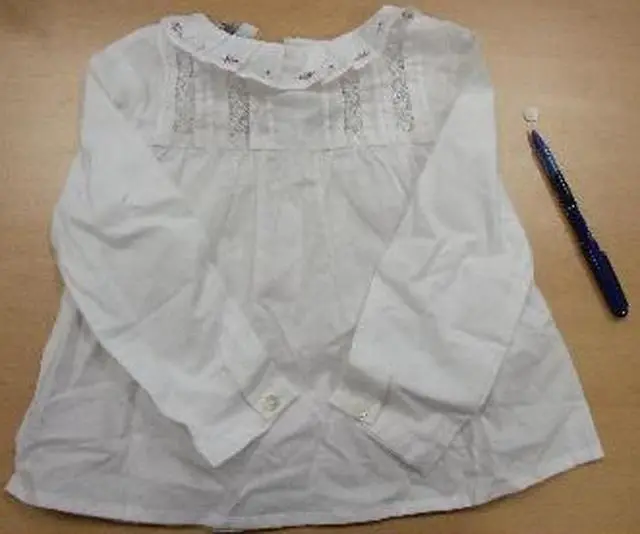 Foto do aviso oficial: NANOS BABY Blusas de bebé ‘Camisa De Bebé’ (shirt do bebé) — risco: Engasgamento