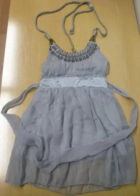 Foto do aviso oficial: Vestido infantil — risco: Estrangulamento