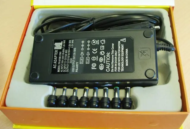 Foto uit de officiële melding: POWER Universal Notebook AC and Car Adaptor Netadapter  &amp; # #13; — risico: Elektrische schok
