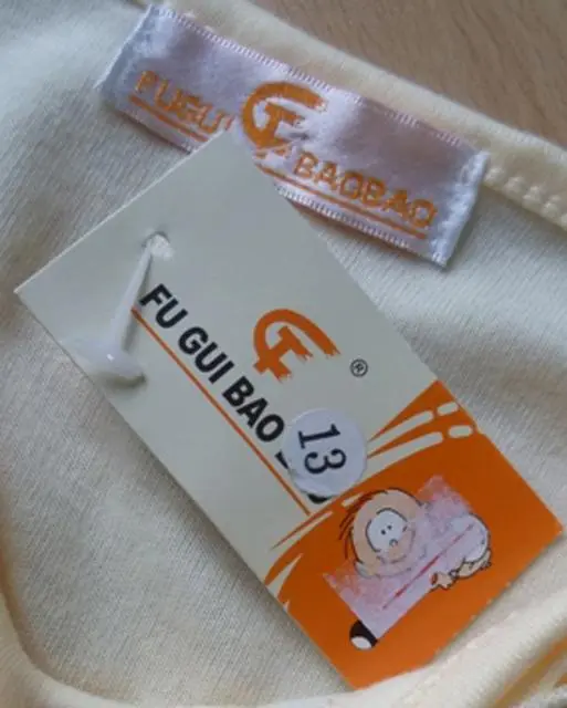 Photo from the official notice: FU GUI BAO BAO children’s tops — strangulation risk