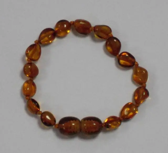 Foto dell’avviso ufficiale: Teething SOS Honey Bean Collana di dentizione ambra e bracciale — rischio: Ostruzione delle vie aeree