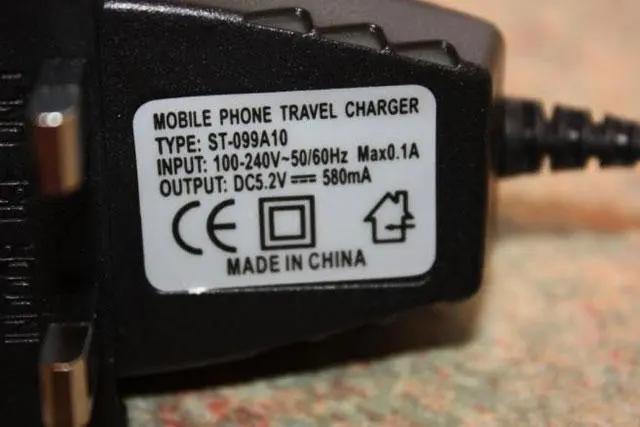 Photo from the official notice: RB Mobile Travel Charger for Z320i — electric shock & fire risk