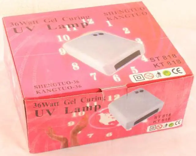 Photo from the official notice: SHENGTUO 36 Watt Gel Curing UV Lamp — electric shock & fire risk