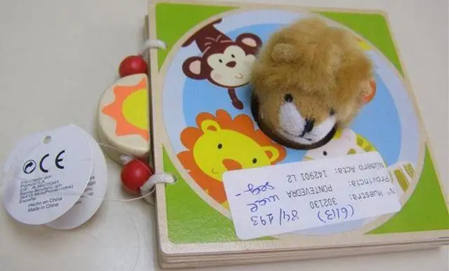 Photo from the official notice: Portico wooden book with puppet — choking risk
