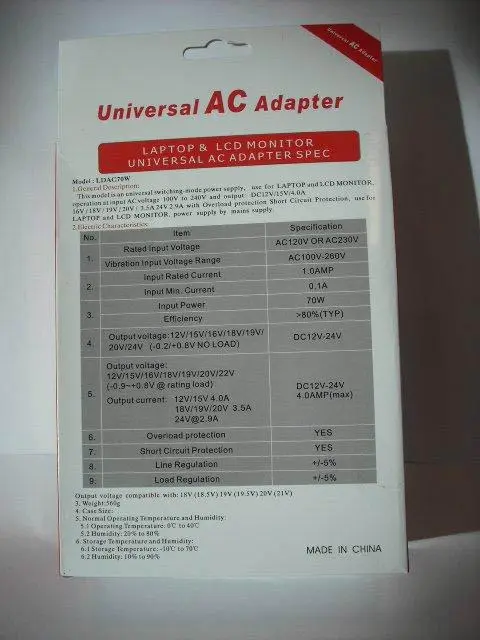 Foto uit de officiële melding: Universal Notebook AC Adapter Voeding — risico: Elektrische schok