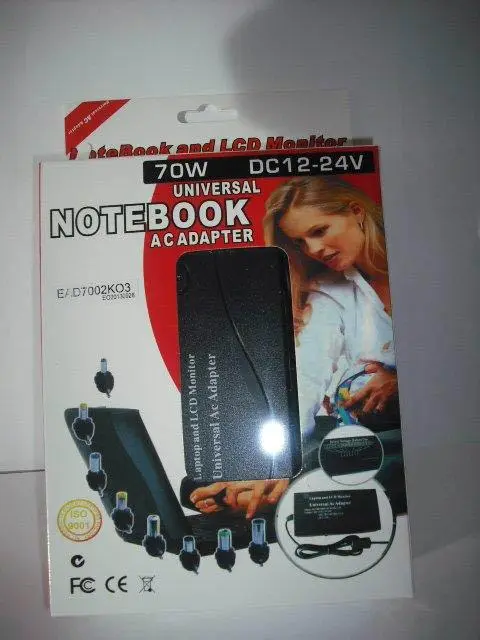 Foto uit de officiële melding: Universal Notebook AC Adapter Voeding — risico: Elektrische schok