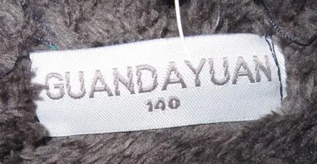 Foto aus der offiziellen Meldung: Guan Da Yuan Kinderpullover — Risiko: Strangulierung