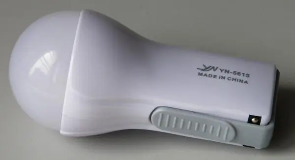 Photo from the official notice: YANUO Rechargeable LED Energy-saving lamp portable led lamp/torch — electric shock & fire risk
