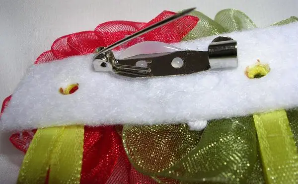 Foto do aviso oficial: Donino Roupa de bebé — risco: Engasgamento & Ferimentos