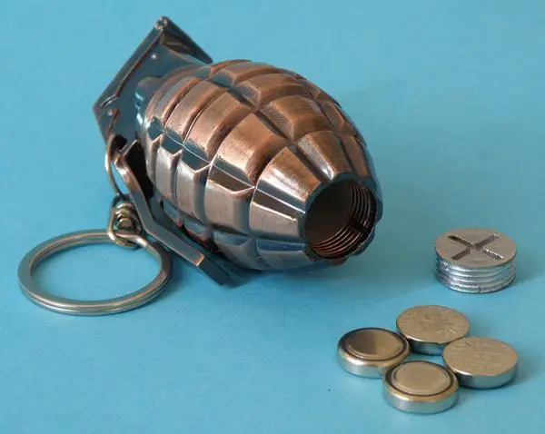 Photo from the official notice: XIONGWEI Grenade laser pointer key-ring — damage to sight risk