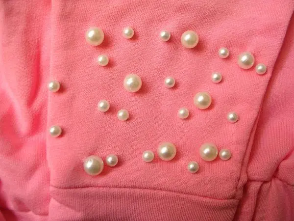 Foto aus der offiziellen Meldung: SOSO Kinderkleidungsset — Risiko: Ersticken