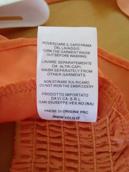 Foto uit de officiële melding: Y-Clu Kinderblouse — risico: Verwonding & Verwurging