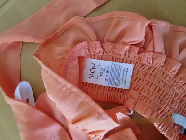 Foto uit de officiële melding: Y-Clu Kinderblouse — risico: Verwonding & Verwurging