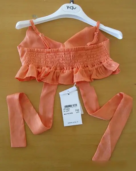 Foto uit de officiële melding: Y-Clu Kinderblouse — risico: Verwonding & Verwurging