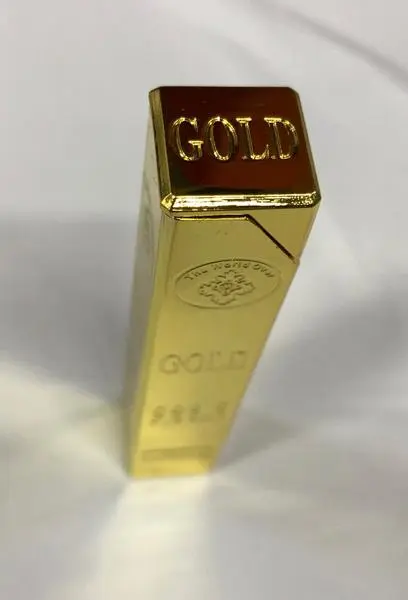 Photo from the official notice: The World Over GOLD 999.9 Fine Gold novelty lighter — burns & fire risk