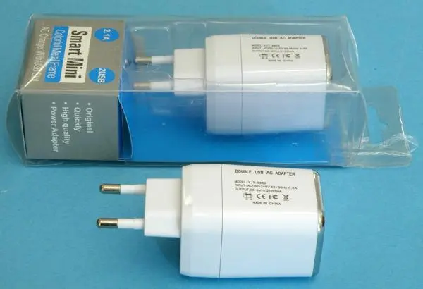 Foto uit de officiële melding: DOUBLE USB AC ADAPTER;  AC Charger With USB Slot USB-oplader — risico: Elektrische schok