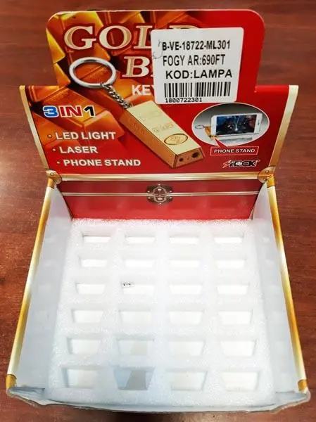 Photo from the official notice: The World Over / SHOCK GOLD BARS KEY CHAIN, 3 IN 1 • LED LIGHT • LASER laser pointer — damage to sight risk