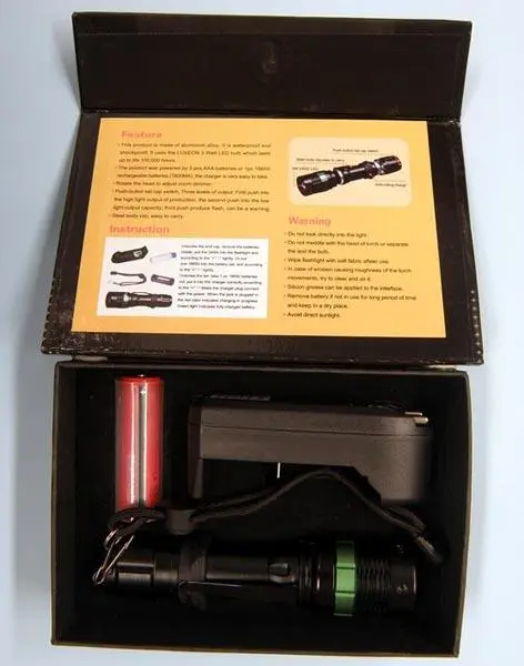 Photo from the official notice: H.Z.M (on the battery charger) POWER STYLE torch with battery charger — electric shock risk