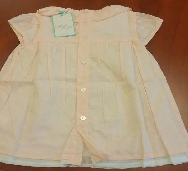 Photo from the official notice: Cotton &amp; Sugar babies' clothing — choking risk (A12/0894/18)