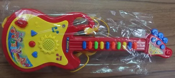 Photo from the official notice: YaYa Toys / ADAR Guitar toy guitar — choking & damage to hearing risk