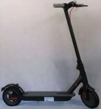 Photo from the official notice: Black, Red and Grey Electric Scooter with Charger — electric shock risk