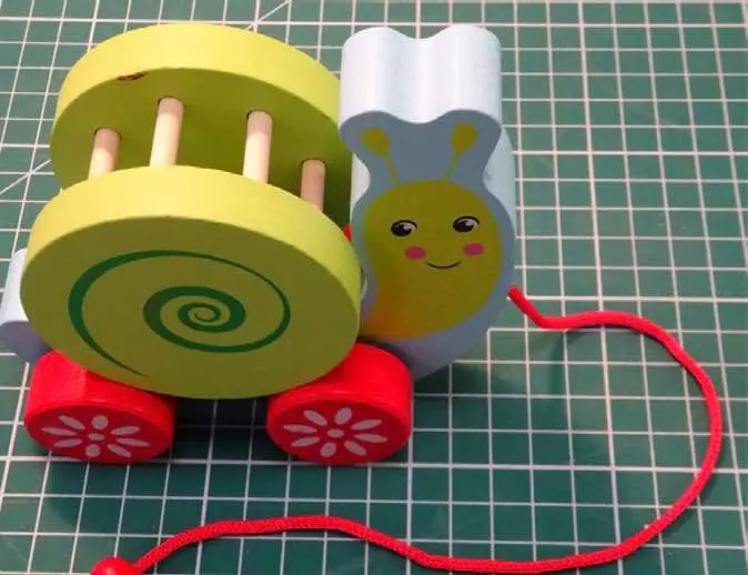 Photo from the official notice: OkOk Animal Drag Snail Pull Along Toy — choking & strangulation risk