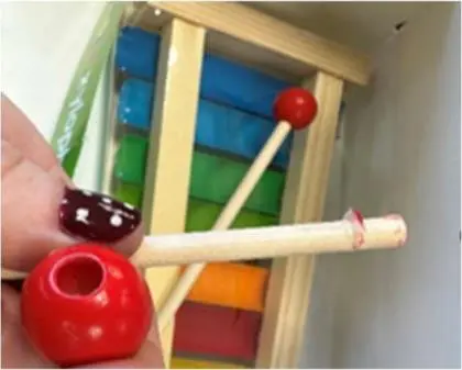 Photo from the official notice: Poundland 'Small and bright' Wooden Xylophone Toy — choking risk