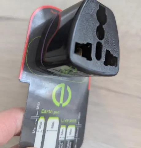 Photo from the official notice: Shen Zhen San Zhi Electric Company Limited Black Travel Adaptor sold via TikTok — electric shock risk